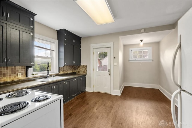 kitchen featuring decorative backsplash, sink, white appliances, and dark wood-type flooring