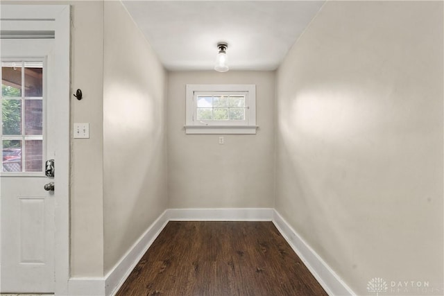 entryway with dark wood-type flooring