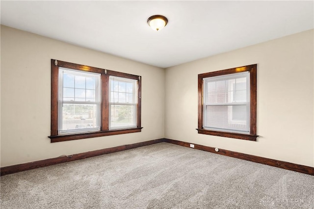 unfurnished room with carpet floors