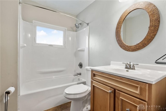 full bathroom with toilet, tile patterned flooring, washtub / shower combination, and vanity