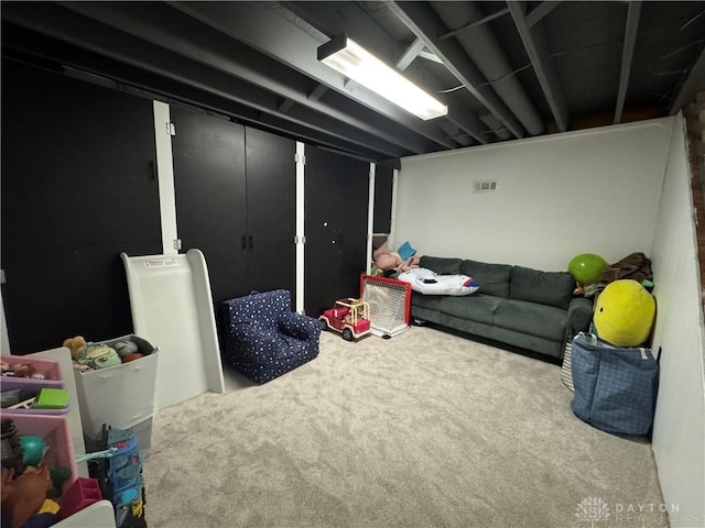 basement featuring carpet flooring