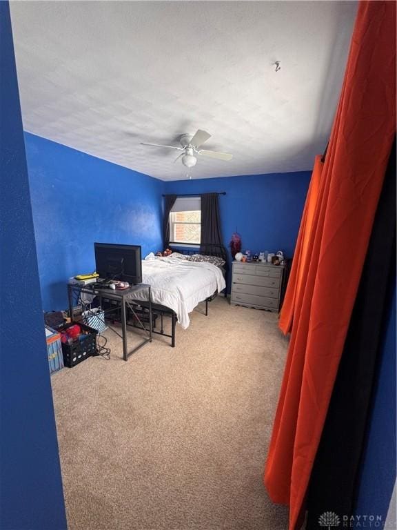 carpeted bedroom with ceiling fan