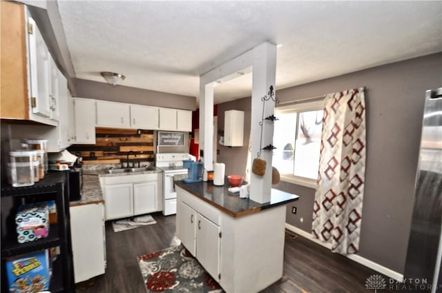 kitchen with dark hardwood / wood-style flooring, sink, white cabinets, and white range with electric cooktop