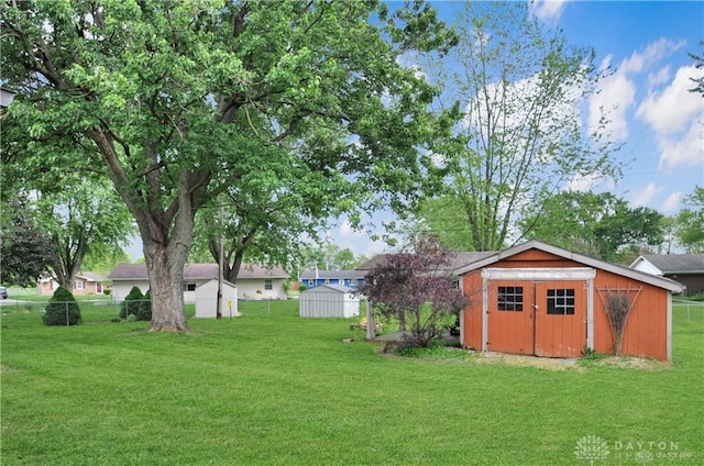 view of yard with a storage unit