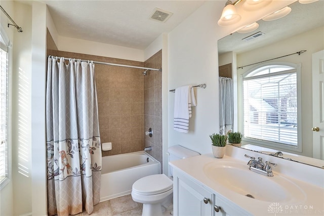 full bath featuring shower / bath combo, visible vents, vanity, and toilet