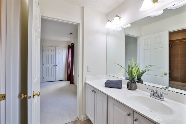 bathroom featuring bathtub / shower combination and vanity