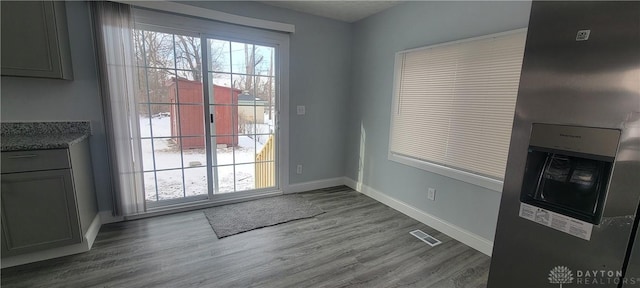 entryway with hardwood / wood-style flooring