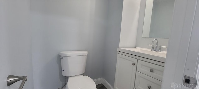 bathroom with toilet and vanity