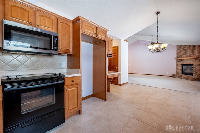 kitchen featuring a fireplace, hanging light fixtures, black range with electric stovetop, backsplash, and lofted ceiling