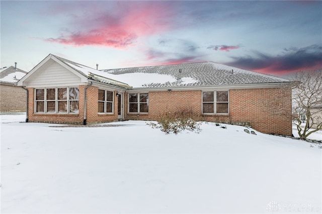 view of snow covered house