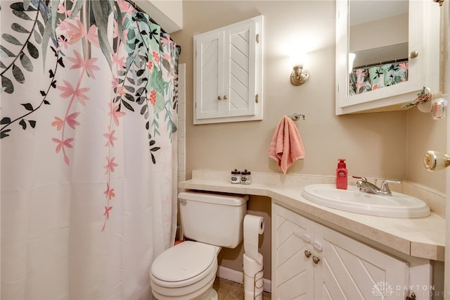 bathroom featuring toilet and vanity