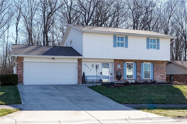 view of front of property with a garage and a front lawn