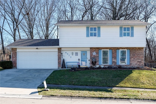 view of front facade with a garage and a front yard