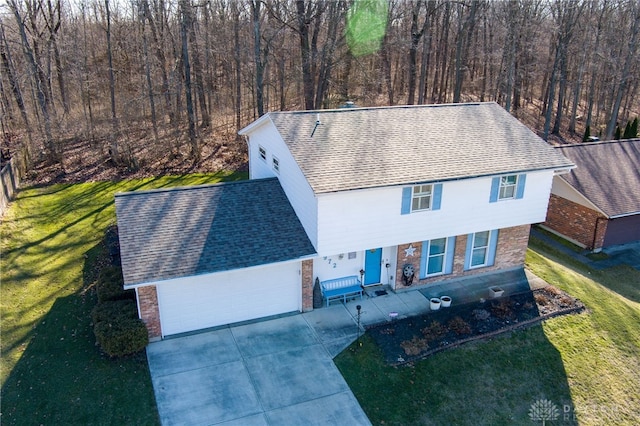 view of front of home with a garage and a front yard