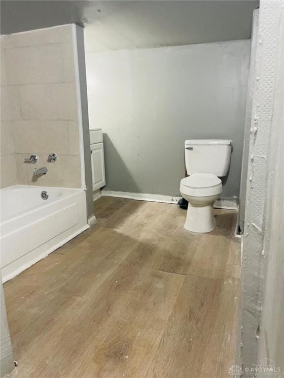 bathroom with wood-type flooring and toilet