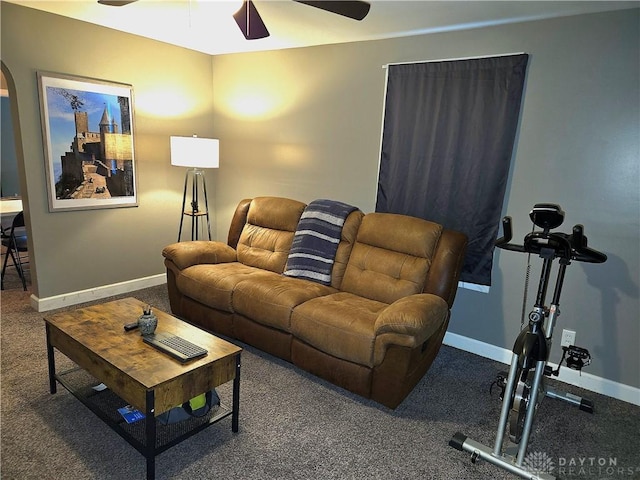 carpeted living room featuring ceiling fan