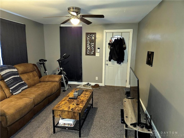 carpeted living room with ceiling fan