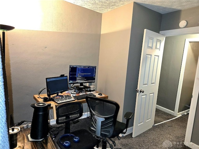 office space with dark carpet and a textured ceiling