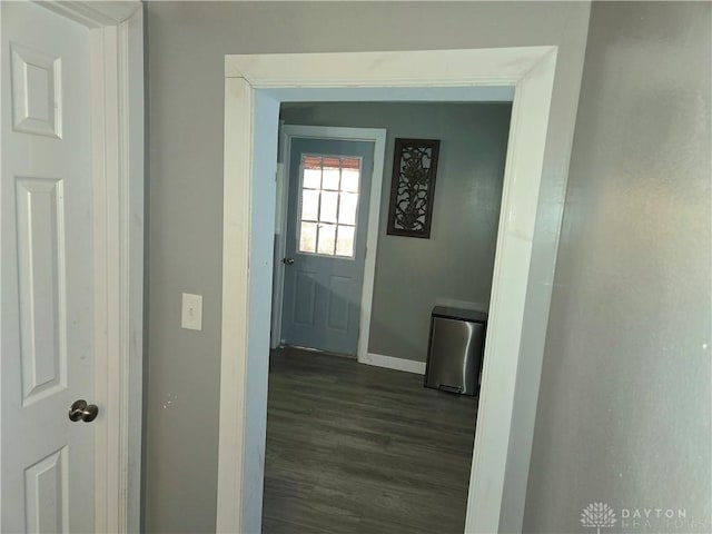 hallway with dark hardwood / wood-style flooring