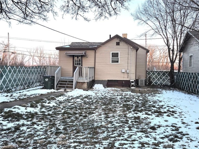 view of snow covered house