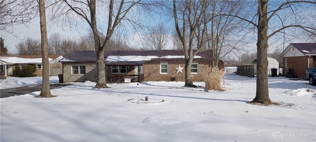 view of front of house featuring brick siding