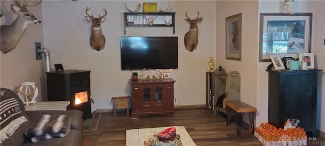 living room featuring baseboards and wood finished floors