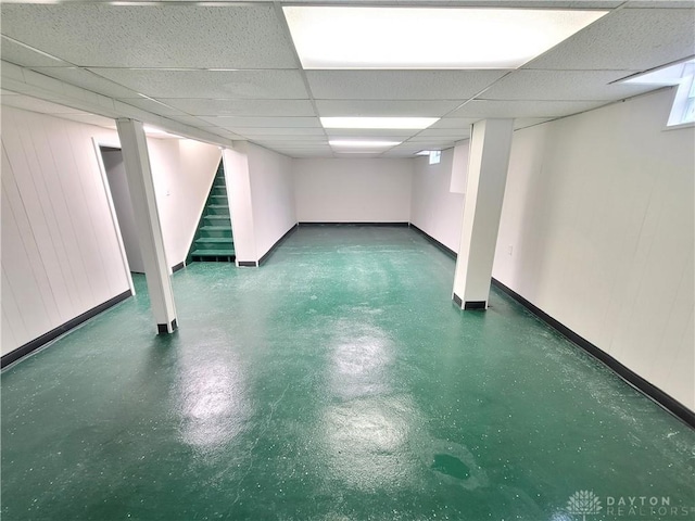 basement featuring a drop ceiling