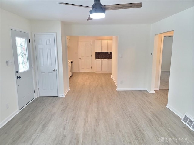 foyer featuring light wood-type flooring and ceiling fan