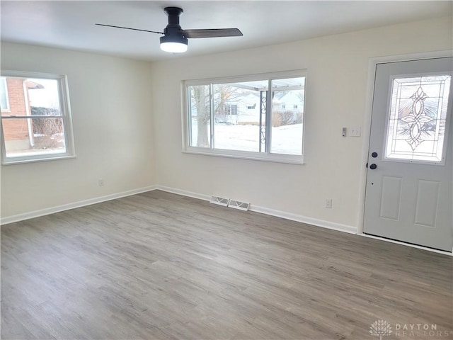 entryway featuring hardwood / wood-style flooring and ceiling fan