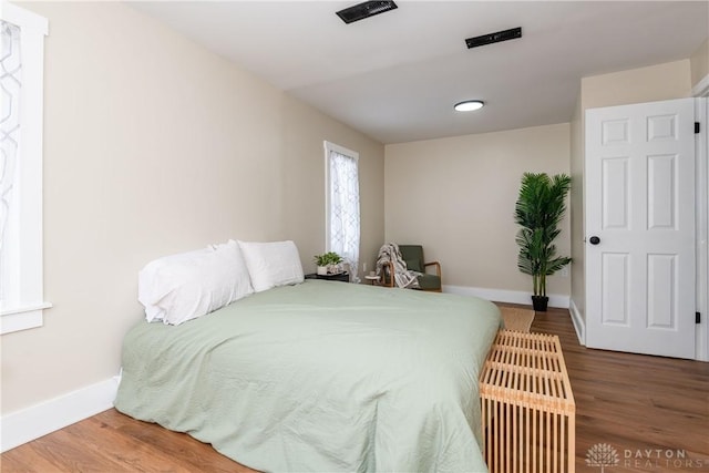 bedroom featuring hardwood / wood-style floors