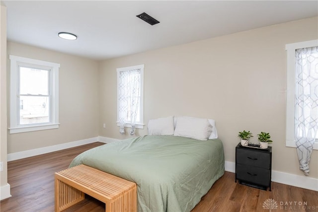 bedroom featuring hardwood / wood-style floors