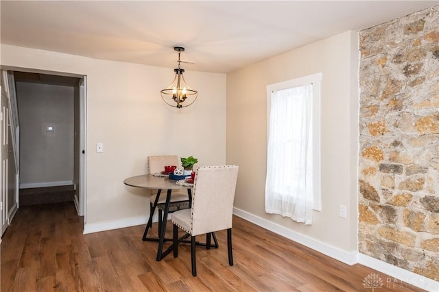 dining room with a chandelier and hardwood / wood-style floors