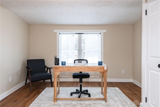 office space with wood-type flooring