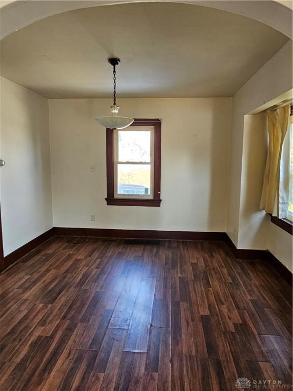 spare room featuring dark hardwood / wood-style flooring