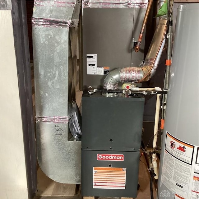 utilities featuring water heater and heating unit