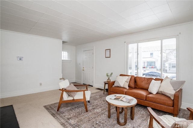 carpeted living room featuring crown molding