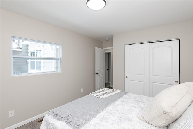 carpeted bedroom featuring a closet