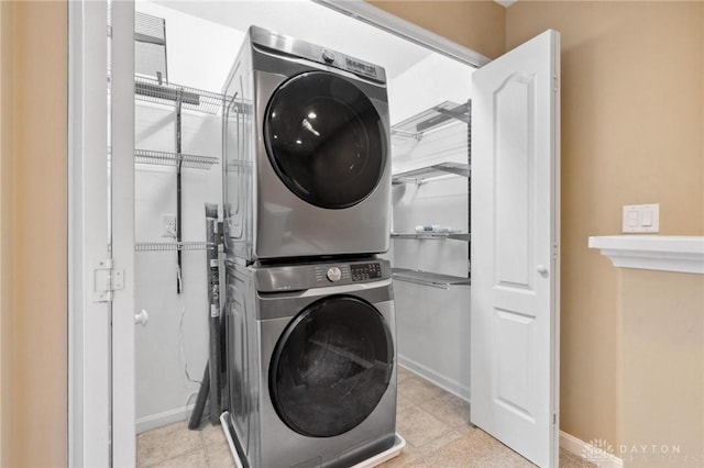 washroom featuring stacked washer / dryer