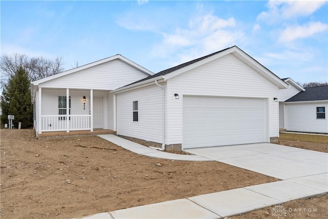 ranch-style house with covered porch and a garage