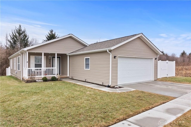 ranch-style house with a garage, covered porch, and a front yard