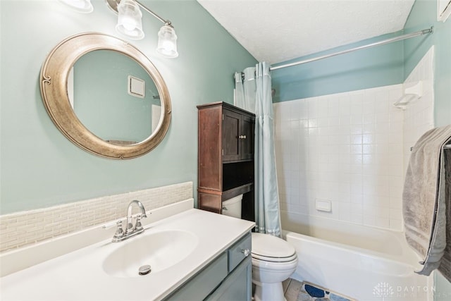 full bathroom featuring vanity, shower / tub combo, a textured ceiling, and toilet