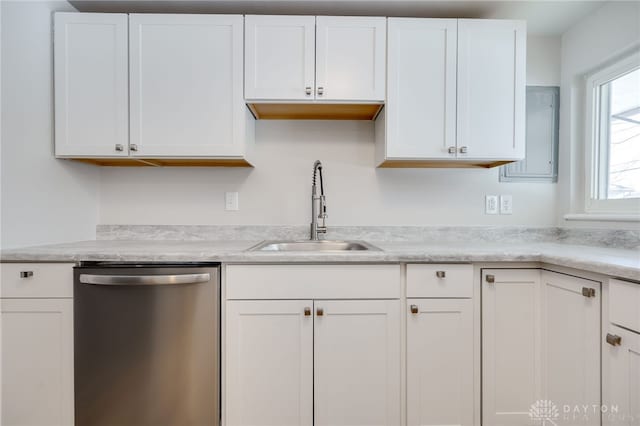 kitchen featuring white cabinetry, sink, and dishwasher