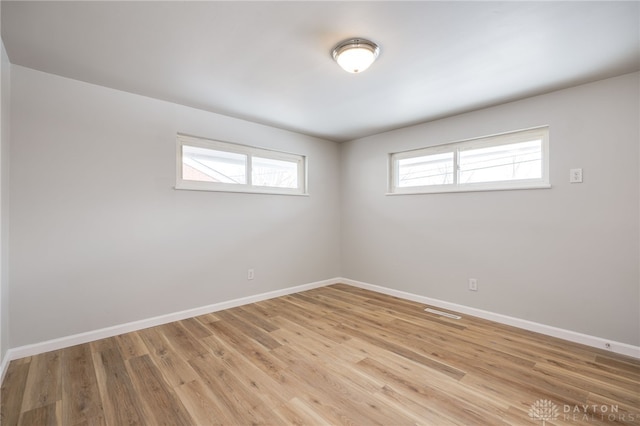 unfurnished room featuring light wood-type flooring