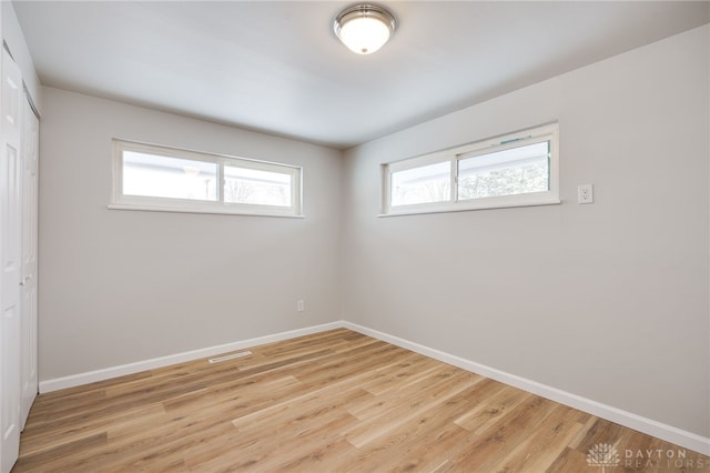 unfurnished room with light hardwood / wood-style flooring