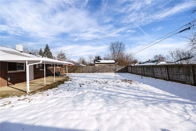 view of yard layered in snow