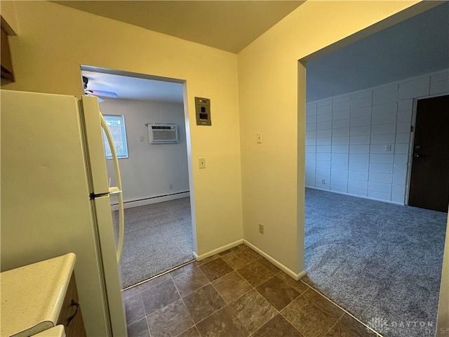 corridor featuring an AC wall unit, dark colored carpet, and a baseboard radiator