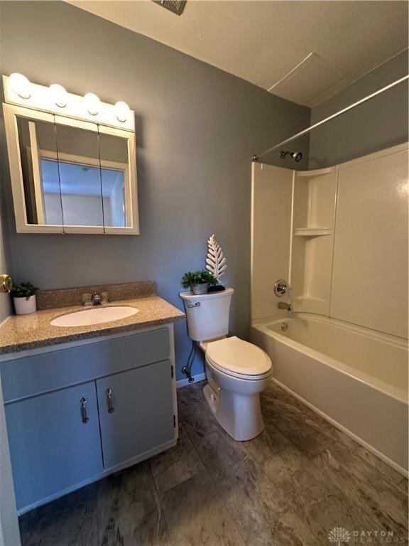 full bathroom featuring shower / bathtub combination, toilet, and vanity