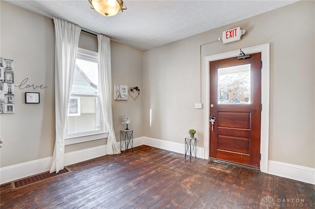 foyer with dark hardwood / wood-style flooring