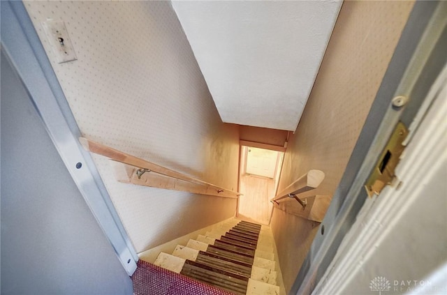 stairway with lofted ceiling