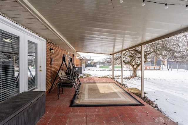 view of snow covered patio